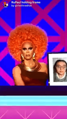 RuPaul holding frame